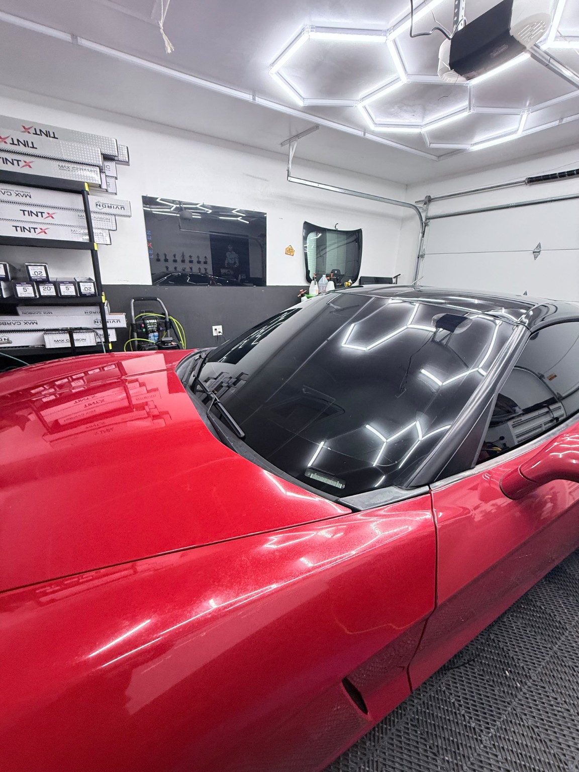 Red sports car with professionally tinted windows