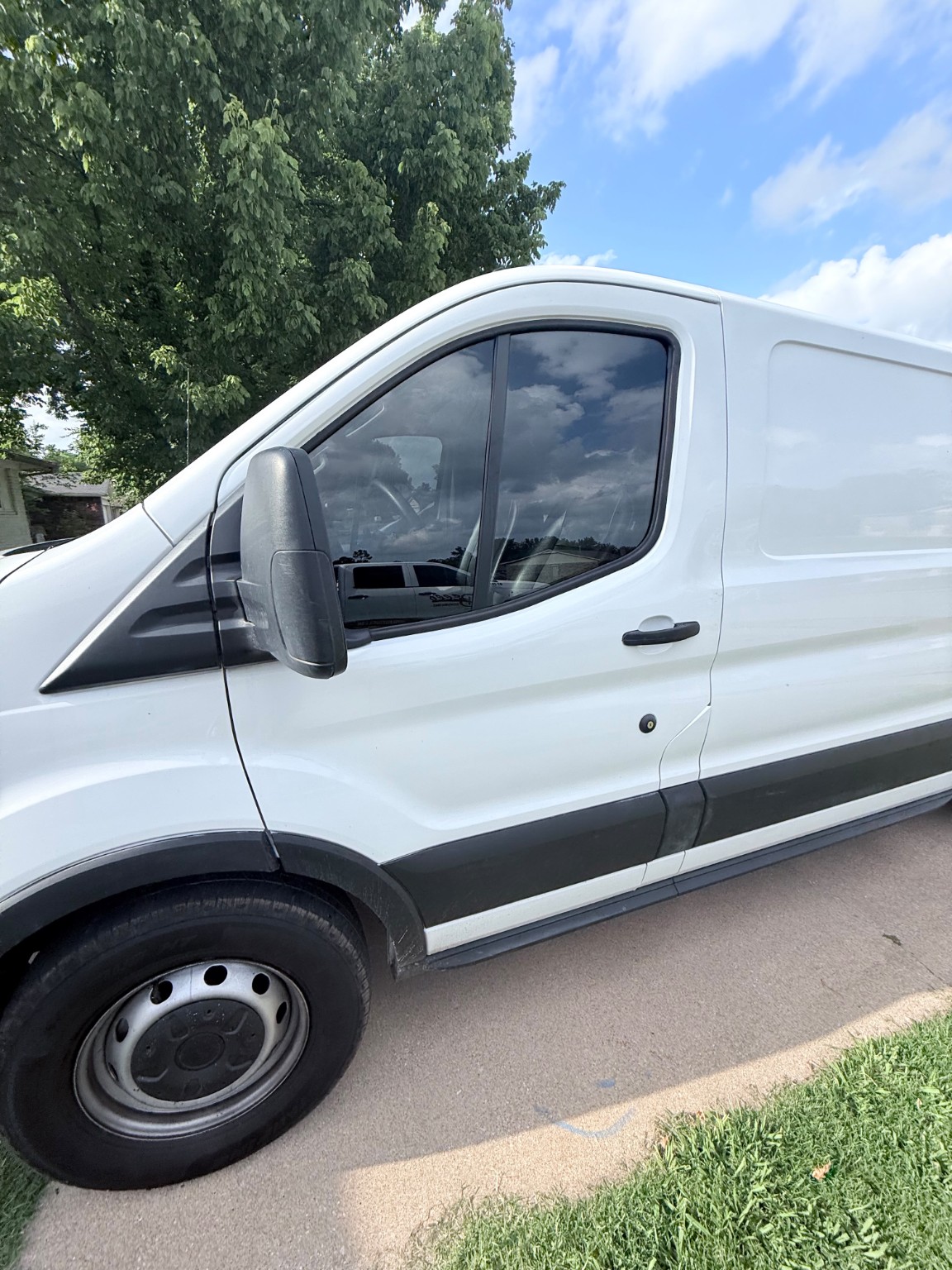 White commercial van with tinted windows